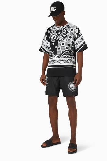 hover state of Dark Side Mid-length Swim Shorts in Bandanna Print