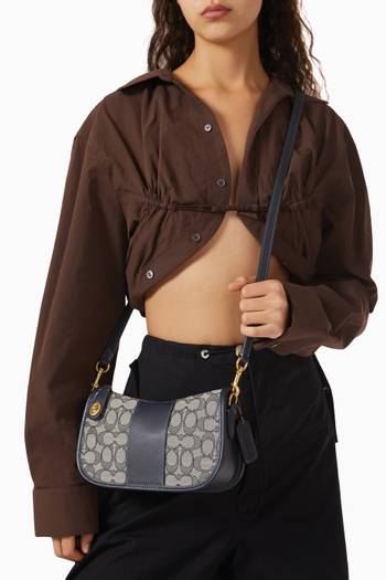 hover state of Swinger Top Handle Bag in Signature Jacquard